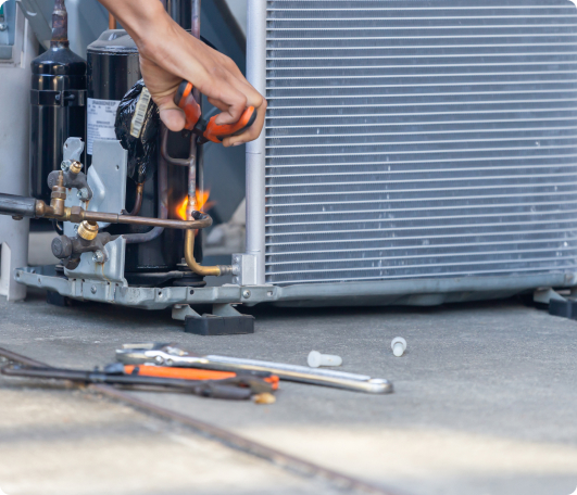 someone repairing an ac unit